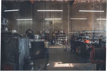 a truck repair shop filled with equipment