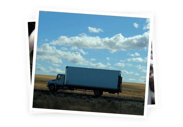 a tractor-trailer on a country road